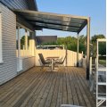 Asiakaskuva Liukukattokuisti 12m² | Liukuva parvekkeen katto | Kanava muovi / alumiini
