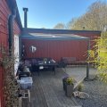 Asiakaskuva Liukukattokuisti 12m² | Liukuva parvekkeen katto | Kanava muovi / alumiini